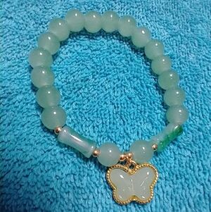 Goldtone green butterfly faux jade stretch bracelet